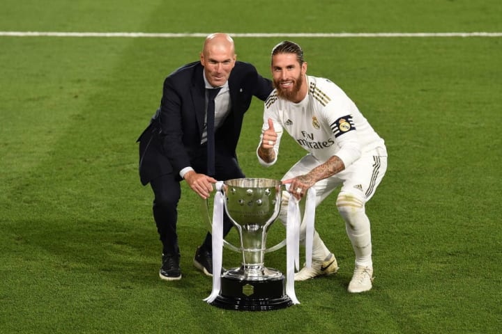 Zinedine Zidane (left) and his dependable captain Sergio Ramos posing with last season's La Liga trophy