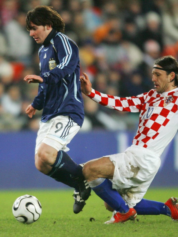 Argentinian's Lionel Messi (L) and Croat