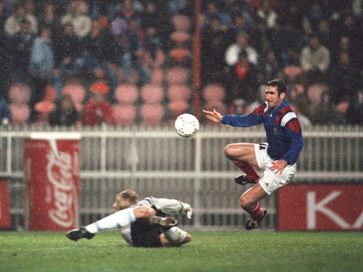 French striker Eric Cantona (C) scores t