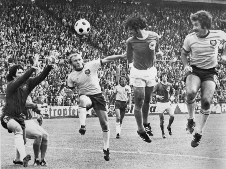 West German forward Gerd Mueller (C) scores on a h