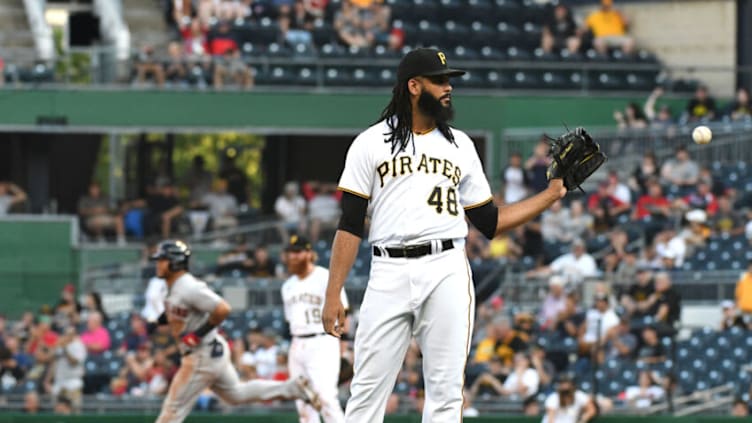 Jun 19, 2021; Pittsburgh, Pennsylvania, USA; Pittsburgh Pirates pitcher Richard Rodriguez (48) gets a new ball after allowing a home run by Cleveland Indians batter Harold Ramirez (40) in the ninth inning at PNC Park. Mandatory Credit: Philip G. Pavely-USA TODAY Sports