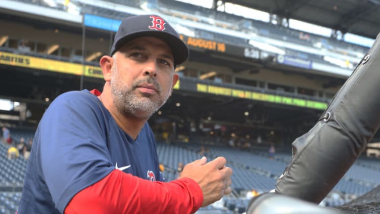 Aug 16, 2022; Pittsburgh, Pennsylvania, USA; Boston Red Sox manager Alex Cora (13) looks on at the batting cage before the game against the Pittsburgh Pirates at PNC Park. Mandatory Credit: Charles LeClaire-USA TODAY Sports