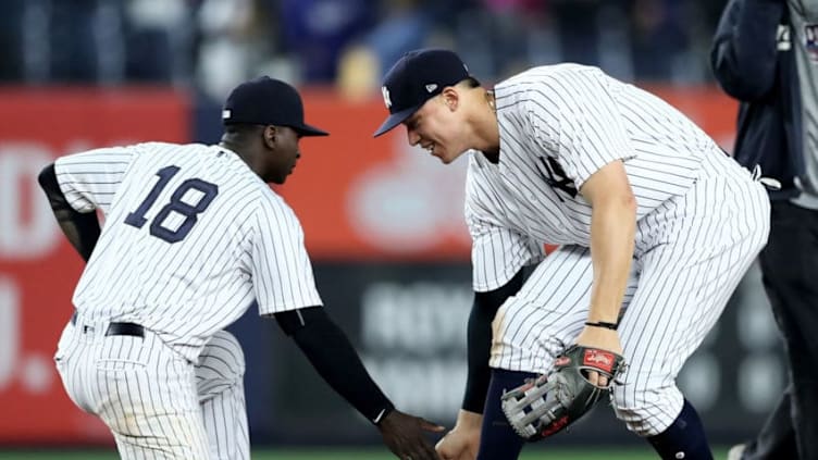 NEW YORK, NY - MAY 22: Didi Gregorius #18 and Aaron Judge #99 of the New York Yankees celebrate the 4-2 win over the Kansas City Royals on May 22, 2017 at Yankee Stadium in the Bronx borough of New York City. (Photo by Elsa/Getty Images)