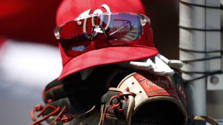 VIERA, FL - MARCH 15: The cap, sunglasses and Rawlings glove of Bryce Harper of the Washington Nationals are shown on the steps of the dugout during a spring training game against the Houston Astros at FITTEAM Ballpark on March 15, 2018 in Viera, Florida. (Photo by Mike McGinnis/Getty Images)