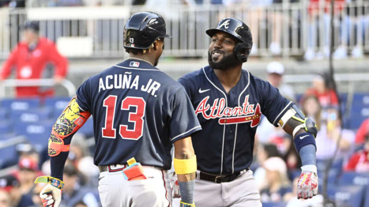 Apr 1, 2023; Washington, District of Columbia, USA; Atlanta Braves designated hitter Marcell Ozuna (20) reacts with right fielder Ronald Acuna Jr. (13) after hitting a solo home run against the Washington Nationals during the fourth inning at Nationals Park. Mandatory Credit: Brad Mills-USA TODAY Sports