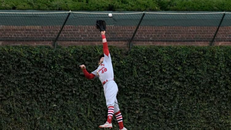 CHICAGO, IL - SEPTEMBER 28: Harrison Bader #48 of the St. Louis Cardinals makes a catch on Jason Heyward #22 of the Chicago Cubs during the sixth inning on September 28, 2018 at Wrigley Field in Chicago, Illinois. (Photo by David Banks/Getty Images)