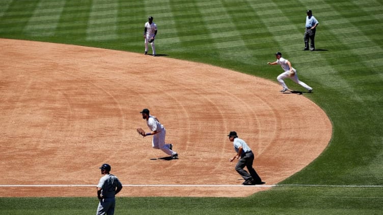 DENVER, CO - AUGUST 05: The Colorado Rockies infield employ the infield shift as they defend against the Seattle Mariners during interleague play at Coors Field on August 5, 2015 in Denver, Colorado. The Rockies defeated the Mariners 7-5 in 11 innings. (Photo by Doug Pensinger/Getty Images)