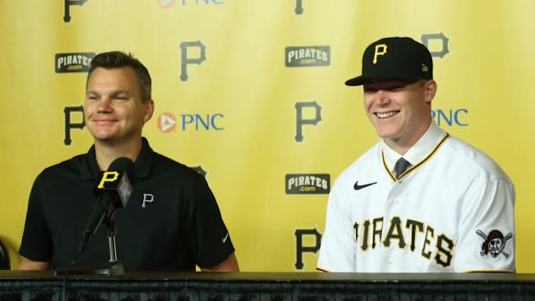 Jul 18, 2021; Pittsburgh, Pennsylvania, USA; Pittsburgh Pirates general manager Ben Cherington (left) introduces catcher Henry Davis (right) who was selected number one overall in the 2021 MLB first year player draft by the Pirates at a news conference before the Pirates play the New York Mets at PNC Park. Mandatory Credit: Charles LeClaire-USA TODAY Sports