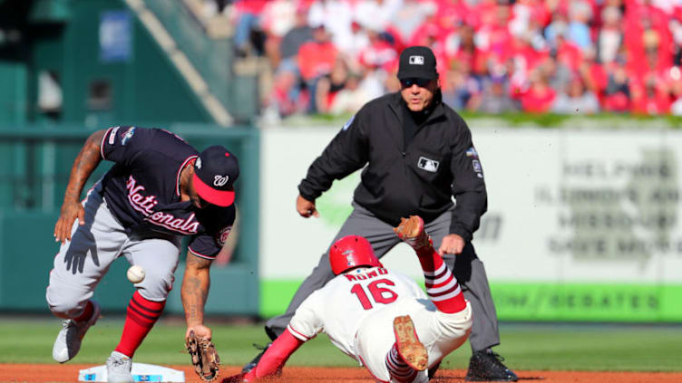 ST. LOUIS, MO - OCTOBER 12: Kolten Wong #16 of the St. Louis Cardinals steals second base, beating the tag of Howie Kendrick #47 of the Washington Nationals, during the first inning of Game 2 of the NLCS at Busch Stadium on Saturday, October 12, 2019 in St. Louis, Missouri. (Photo by Dilip Vishwanat/MLB Photos via Getty Images)