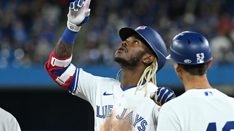 Apr 15, 2022; Toronto, Ontario, CAN; Toronto Blue Jays right fielder Raimel Tapia (15) reacts after hitting a single against the Oakland Athletics in the fourth inning at Rogers Centre. Mandatory Credit: Dan Hamilton-USA TODAY Sports