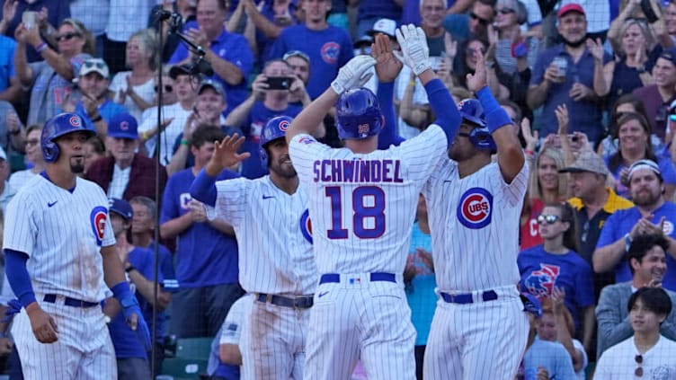 Sep 5, 2021; Chicago, Illinois, USA; Chicago Cubs first baseman Frank Schwindel (18) is greeted after hitting a grand slam home run against the Pittsburgh Pirates during the seventh inning at Wrigley Field. Mandatory Credit: David Banks-USA TODAY Sports