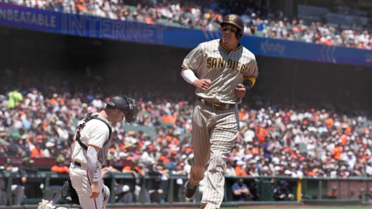 May 22, 2022; San Francisco, California, USA; San Diego Padres third baseman Manny Machado (13) scores a run during the first inning against the San Francisco Giants at Oracle Park. Mandatory Credit: Darren Yamashita-USA TODAY Sports