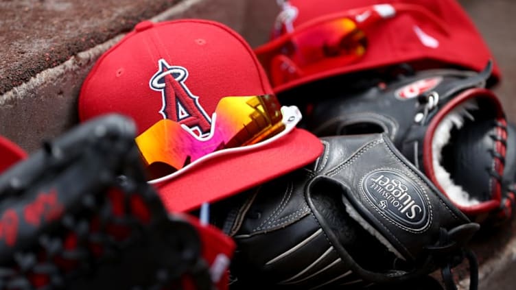 ANAHEIM, CA - APRIL 09: A detail view of Los Angeles Angels of Anaheim hats and gloves during a game against the Seattle Mariners at Angel Stadium of Anaheim on April 9, 2017 in Anaheim, California. (Photo by Sean M. Haffey/Getty Images)