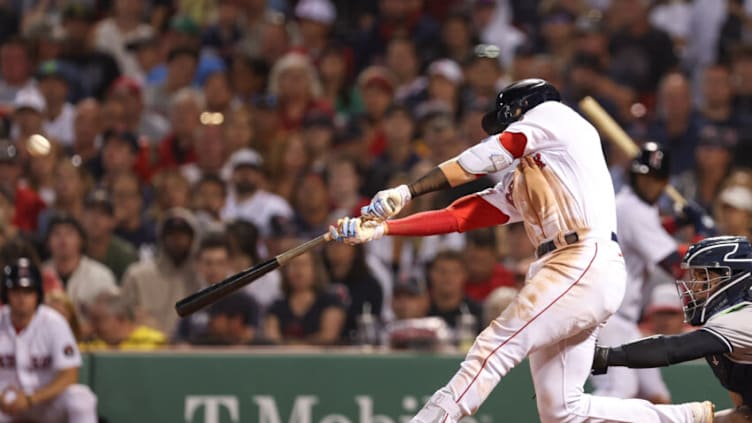 Jul 10, 2022; Boston, Massachusetts, USA; Boston Red Sox second baseman Trevor Story (10) hits a three-run RBI double during the seventh inning against the New York Yankees at Fenway Park. Mandatory Credit: Paul Rutherford-USA TODAY Sports