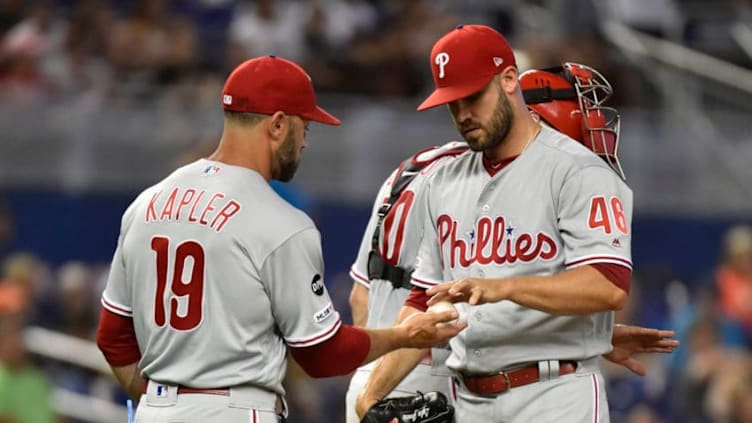 MIAMI, FL - JUNE 29: Manager Gabe Kapler #19 of the Philadelphia Phillies takes the baseball from Adam Morgan #46 after making a pitching change in the seventh inning against the Miami Marlins at Marlins Park on June 29, 2019 in Miami, Florida. (Photo by Eric Espada/Getty Images)