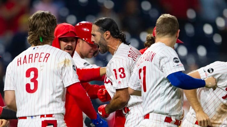 PHILADELPHIA, PA - AUGUST 26: Sean Rodriguez #13 of the Philadelphia Phillies celebrates with Bryce Harper #3 and Corey Dickerson #31 after hitting a walk-off solo home run in the bottom of the eleventh inning against the Pittsburgh Pirates at Citizens Bank Park on August 26, 2019 in Philadelphia, Pennsylvania. The Phillies defeated the Pirates 6-5. (Photo by Mitchell Leff/Getty Images)