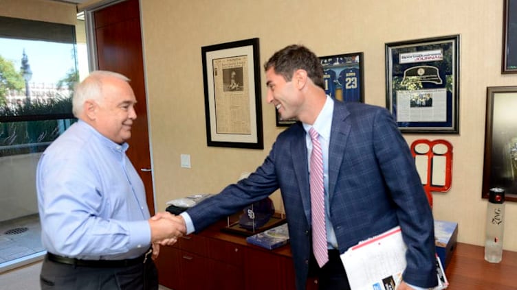 SAN DIEGO, CA - AUGUST 6: Executive Chairman Ron Fowler of the San Diego Padres greets A.J. Preller prior to his introduction to the media as the new General Manager of the San Diego Padres at a press conference at Petco Park on August 6, 2014 in San Diego, California. (Photo by Andy Hayt/San Diego Padres/Getty Images) *** LOCAL CAPTION *** A.J. Preller;Ron Fowler