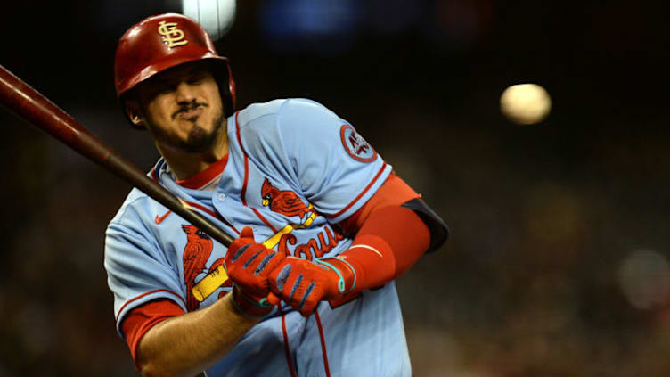 May 29, 2021; Phoenix, Arizona, USA; St. Louis Cardinals third baseman Nolan Arenado (28) gets hit by a pitch against the Arizona Diamondbacks during the third inning at Chase Field. Mandatory Credit: Joe Camporeale-USA TODAY Sports