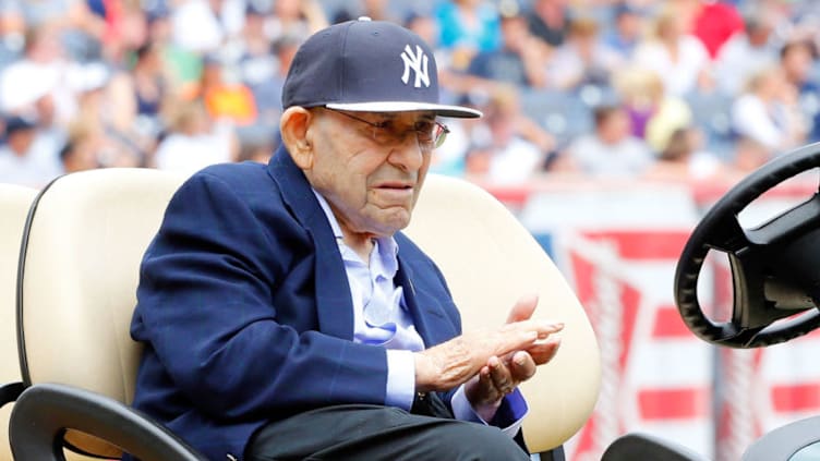 NEW YORK, NY - AUGUST 23: New York Yankee Hall of Famer Yogi Berra attends a ceremony at Yankee Stadium honoring former manager Joe Torre prior to a game against the Chicago White Sox on August 23, 2014 in the Bronx borough of New York City. The Yankees retired Torre's #6 and presented a plaque that will be installed in Monument Park The Yankees defeated the White Sox 5-3. (Photo by Jim McIsaac/Getty Images)