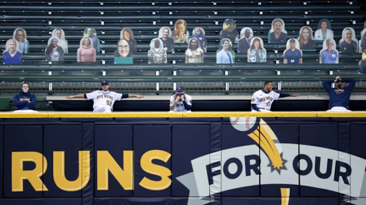 MILWAUKEE, WISCONSIN - AUGUST 08: Members of the Milwaukee Brewers bullpen look on during the game against the Cincinnati Reds at Miller Park on August 08, 2020 in Milwaukee, Wisconsin. (Photo by Dylan Buell/Getty Images)