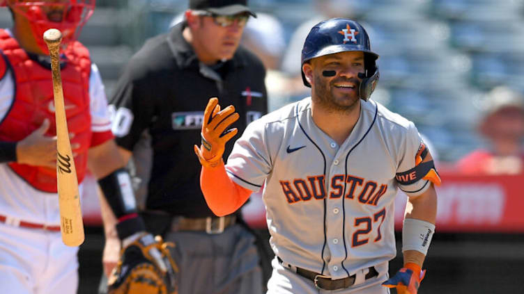 Aug 15, 2021; Anaheim, California, USA; Houston Astros second baseman Jose Altuve (27) flips his bat after flying out in the fifth inning against the Los Angeles Angels at Angel Stadium. Mandatory Credit: Jayne Kamin-Oncea-USA TODAY Sports