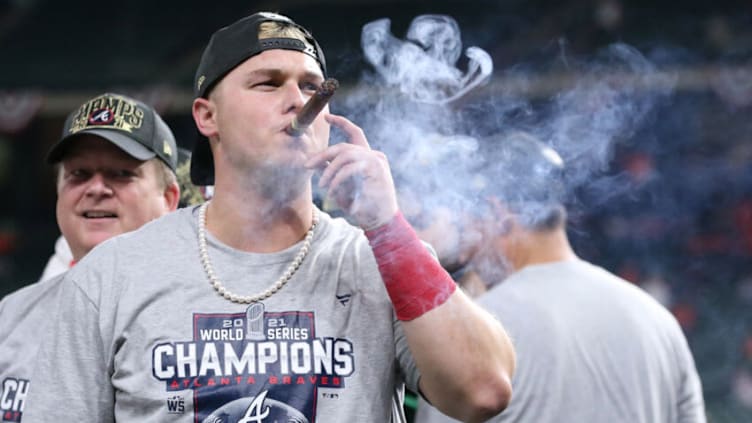 Nov 2, 2021; Houston, TX, USA; Atlanta Braves right fielder Joc Pederson smokes a cigar after defeating the Houston Astros in game six of the 2021 World Series at Minute Maid Park. Mandatory Credit: Troy Taormina-USA TODAY Sports