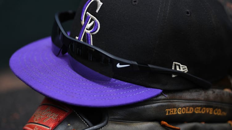 SAN FRANCISCO, CA - JUNE 28: A detailed view of the Nike sunglasses, Rawlings baseball glove and hat belonging to Charlie Blackmon #19 of the Colorado Rockies sitting on the dugout steps against the San Francisco Giants at AT&T Park on June 28, 2017 in San Francisco, California. (Photo by Thearon W. Henderson/Getty Images)