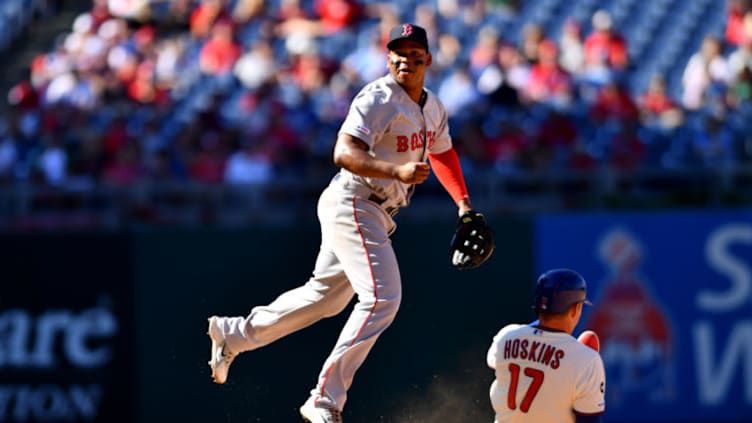 PHILADELPHIA, PA - SEPTEMBER 15: Boston Red Sox Shortstop Xander Bogaerts (2) turns a double play in the eighth inning during the game between the Boston Red Sox and Philadelphia Phillies on September 15, 2019 at Citizens Bank Park in Philadelphia, PA. (Photo by Kyle Ross/Icon Sportswire via Getty Images)