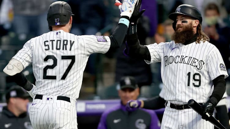 DENVER, COLORADO - APRIL 23: Trevor Story #27 of the Colorado Rockies is congratulated by Charlie Blackmon #19 after hitting a solo home run against the Philadelphia Phillies in the fourth inning at Coors Field on April 23, 2021 in Denver, Colorado. (Photo by Matthew Stockman/Getty Images)