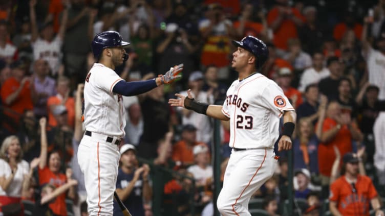 Jun 30, 2021; Houston, Texas, USA; Houston Astros left fielder Michael Brantley (23) celebrates with shortstop Carlos Correa (1) after scoring a run during the fourth inning against the Baltimore Orioles at Minute Maid Park. Mandatory Credit: Troy Taormina-USA TODAY Sports