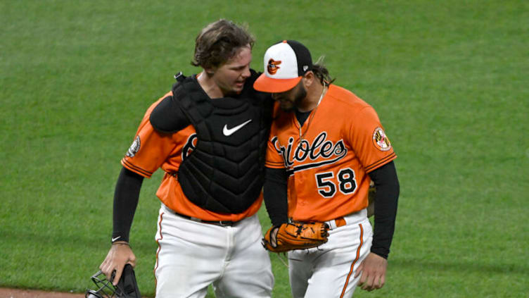 Jul 23, 2022; Baltimore, Maryland, USA; Baltimore Orioles catcher Adley Rutschman (35) talks with relief pitcher Cionel Perez (58) after the seventh inning against the New York Yankees at Oriole Park at Camden Yards. Mandatory Credit: James A. Pittman-USA TODAY Sports