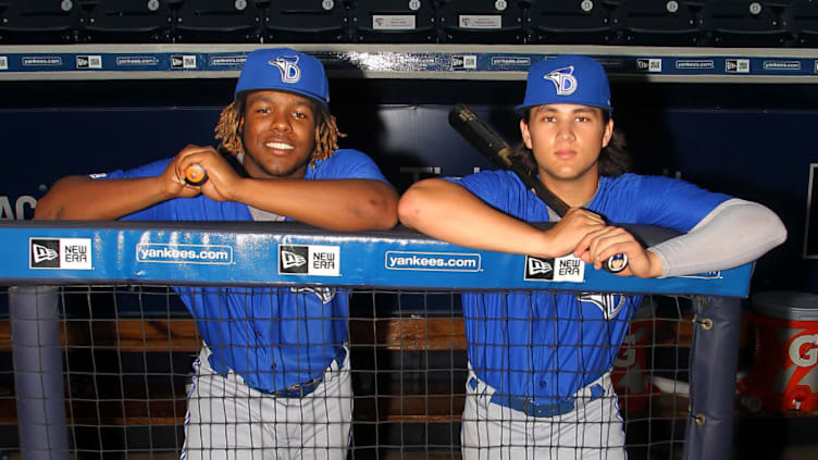 TAMPA, FL - JULY 12: Blue Jays prospects Vladimir Guerrero Jr. and Bo Bichette pose together before the Florida State League game between the Dunedin Blue Jays and the Tampa Yankees on July 12, 2017, at Steinbrenner Field in Tampa, FL. Guerrero and Bichette are both sons of former all-star big leaguers, Vladdy's father is Vladimir Guerrero and Bo's father is Dante Bichette. (Photo by Cliff Welch/Icon Sportswire via Getty Images)