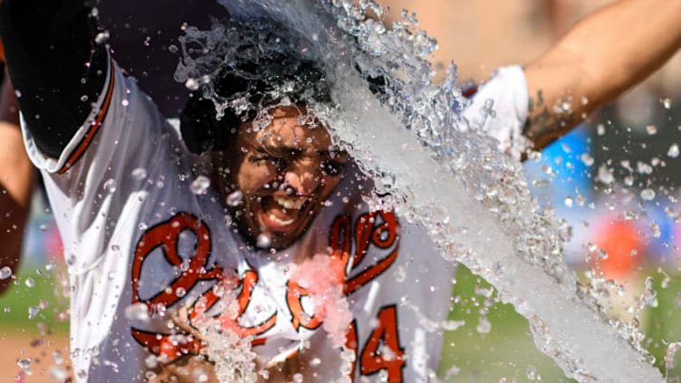 BALTIMORE, MD - AUGUST 11: Baltimore Orioles third baseman Rio Ruiz (14) is doused with liquid after hitting a game winning two run home run against the Houston Astros on August 9, 2019, at Orioles Park at Camden Yards in Baltimore, MD. (Photo by Mark Goldman/Icon Sportswire via Getty Images)