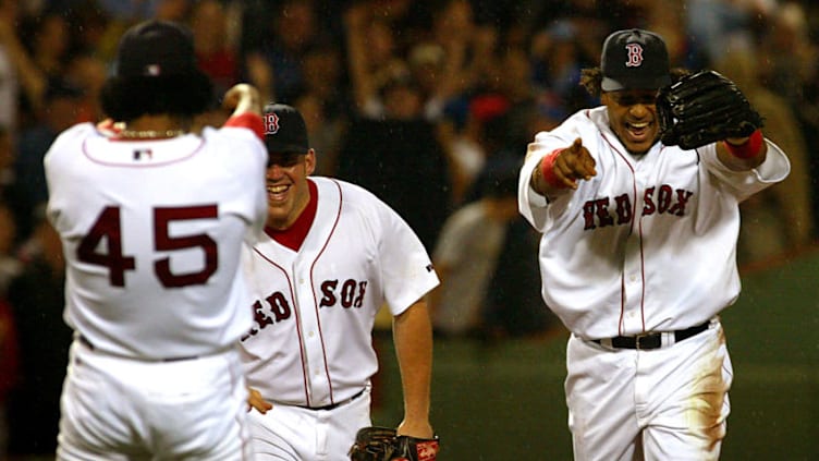 BOSTON - JUNE 25: Pedro Martinez and Manny Ramirez point to each other after Manny's catch to end the seventh inning. (Photo by Barry Chin/The Boston Globe via Getty Images)