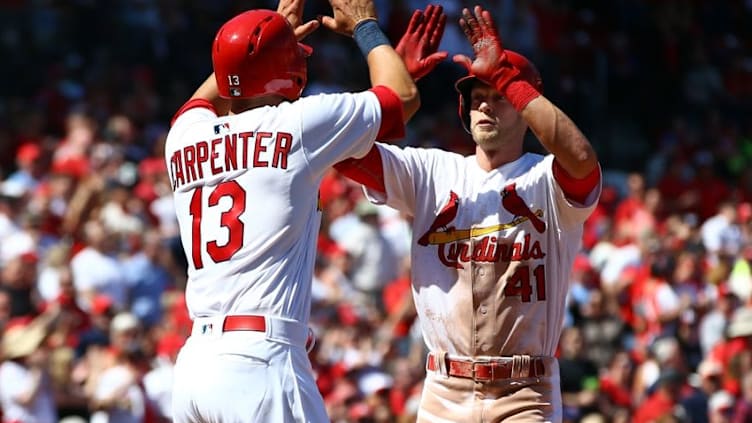 Apr 14, 2016; St. Louis, MO, USA; St. Louis Cardinals right fielder Jeremy Hazelbaker (41) is congratulated by Matt Carpenter (13) after hitting a two run home run off of Milwaukee Brewers starting pitcher Chris Capuano (not pictured) during the seventh inning at Busch Stadium. The Cardinals won the game 7-0. Mandatory Credit: Billy Hurst-USA TODAY Sports