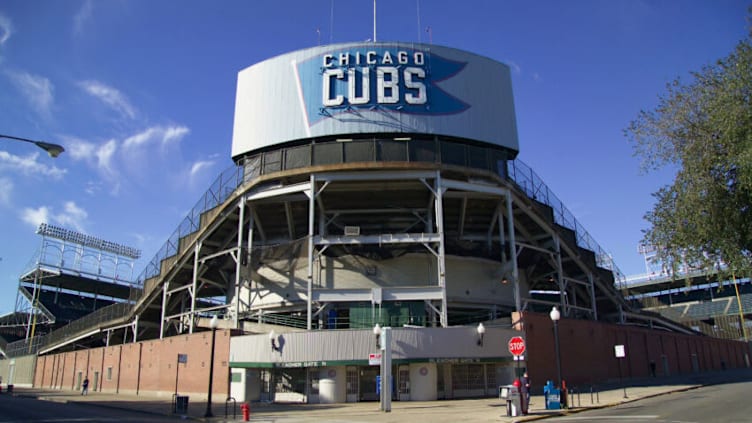 CHICAGO, IL - SEPTEMBER 25: A general view of the back of the historic center field hand-operated scoreboard outside Wrigley Field the home of the Chicago Cubs from the corner of Waveland Avenue and Sheffield Avenue on September 25, 2004 in Chicago, Illinois. (Photo by Tom Szczerbowski/Getty Images)