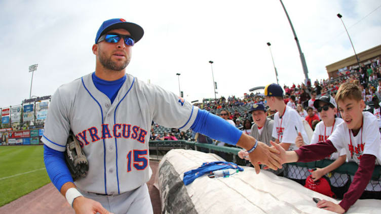 ALLENTOWN, PA - MAY 02: Tim Tebow #15 of the Syracuse Mets slaps hands with fans before a AAA minor league baseball game against the Lehigh Valley Iron Pigs on May 1, 2019 at Coca Cola Park in Allentown, Pennsylvania. (Photo by Rich Schultz/Getty Images)