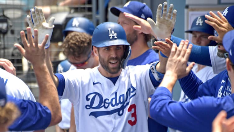 Jul 25, 2021; Los Angeles, California, USA; Los Angeles Dodgers left fielder Chris Taylor (3) is congratulated in the dugout after hitting a solo home run in the first inning of the game against the Colorado Rockies at Dodger Stadium. Mandatory Credit: Jayne Kamin-Oncea-USA TODAY Sports