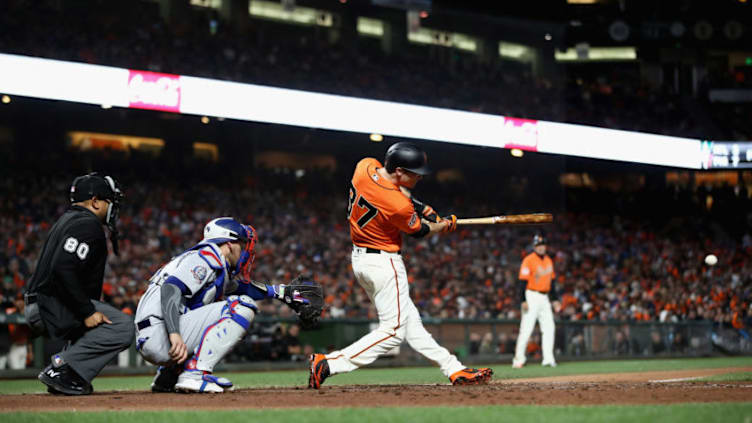 SAN FRANCISCO, CA - APRIL 27: Kelby Tomlinson #37 of the San Francisco Giants hits a RBI double in the seventh inning against the Los Angeles Dodgers at AT&T Park on April 27, 2018 in San Francisco, California. (Photo by Ezra Shaw/Getty Images)