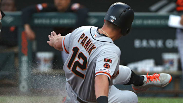 BALTIMORE, MARYLAND - MAY 31: Joe Panik #12 of the San Francisco Giants scores against the Baltimore Orioles during the first inning at Oriole Park at Camden Yards on May 31, 2019 in Baltimore, Maryland. (Photo by Patrick Smith/Getty Images)