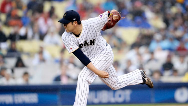 March 21, 2017; Los Angeles, CA, USA; Japan pitcher Tomoyuki Sugano (11) throws against USA in the first inning during the 2017 World Baseball Classic at Dodger Stadium. Mandatory Credit: Gary A. Vasquez-USA TODAY Sports