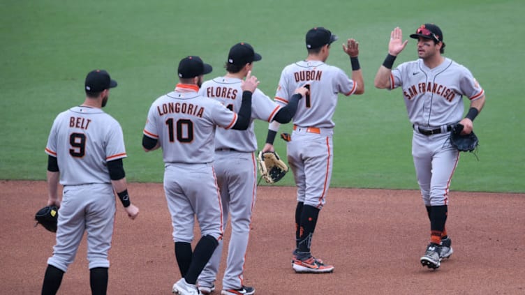 SF Giants players celebrate on the field after defeating the San Diego Padres at Petco Park. (Orlando Ramirez-USA TODAY Sports)