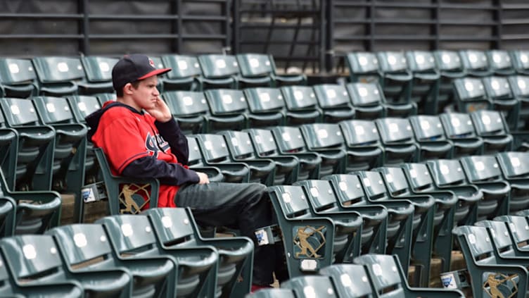 CLEVELAND, OHIO - SEPTEMBER 26: A Cleveland Indians fan takes in the view at Progressive Field after the game between the Cleveland Indians and the Chicago White Sox on September 26, 2021 in Cleveland, Ohio. The White Sox defeated the Indians 5-2. (Photo by Jason Miller/Getty Images)