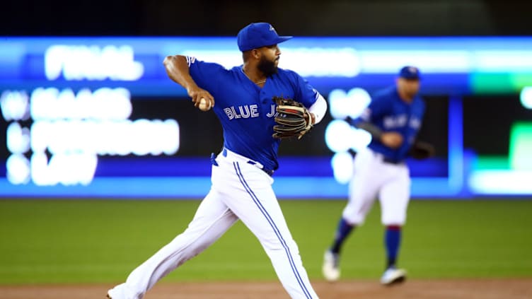 TORONTO, ON - APRIL 24: Richard Urena #7 of the Toronto Blue Jays throws to first for the final out of the first inning during a MLB game against the San Francisco Giants at Rogers Centre on April 24, 2019 in Toronto, Canada. (Photo by Vaughn Ridley/Getty Images)