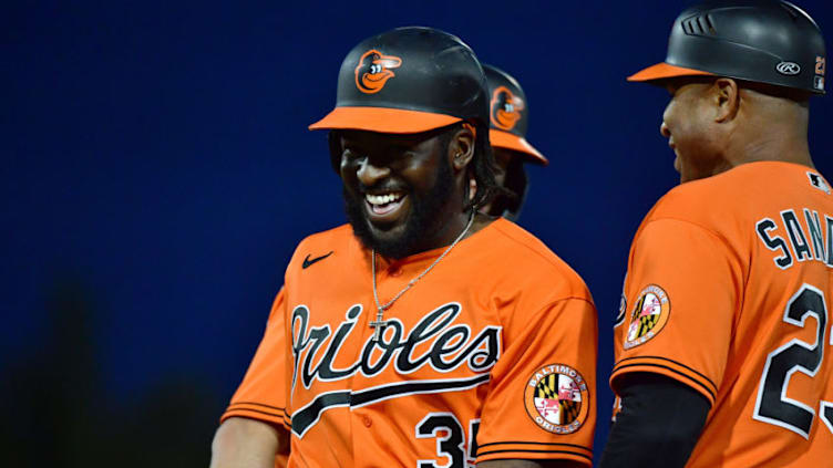 SARASOTA, FLORIDA - MARCH 10: Dwight Smith Jr. #35 of the Baltimore Orioles laughs it off after being hit by a pitch thrown by Philip Pfeifer #67 of the Atlanta Braves during the sixth inning of a Grapefruit League spring training game at Ed Smith Stadium on March 10, 2020 in Sarasota, Florida. (Photo by Julio Aguilar/Getty Images)