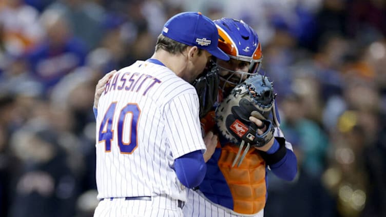 NEW YORK, NEW YORK - OCTOBER 09: Chris Bassitt #40 and Tomas Nido #3 of the New York Mets talk on the mound against the San Diego Padres during the second inning in game three of the National League Wild Card Series at Citi Field on October 09, 2022 in the Flushing neighborhood of the Queens borough of New York City. (Photo by Sarah Stier/Getty Images)