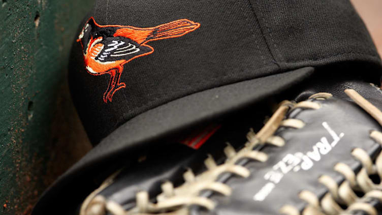 ARLINGTON, TX - APRIL 08: Detail view of a hat and glove of the Baltimore Orioles resting in the dugout during the game against the Texas Rangers on April 8, 2008 at Rangers Ballpark in Arlington, Texas. The Orioles defeated the Rangers 8-1. (Photo by Chris Graythen/Getty Images)