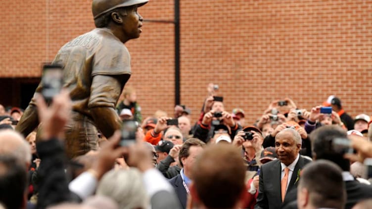 Former major league baseball player Frank Robinson watches the unveiling of his bronze sculpture before a baseball game between the Baltimore Orioles and Oakland Athletics at Oriole Park at Camden Yards on April 28, 2012 in Baltimore, Maryland. (Photo by Mitchell Layton/Getty Images)