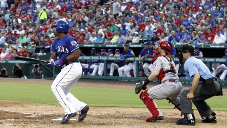 Jun 22, 2016; Arlington, TX, USA; Texas Rangers third baseman Adrian Beltre (29) drives in a run with a single in the fourth inning against the Cincinnati Reds at Globe Life Park in Arlington. Mandatory Credit: Tim Heitman-USA TODAY Sports