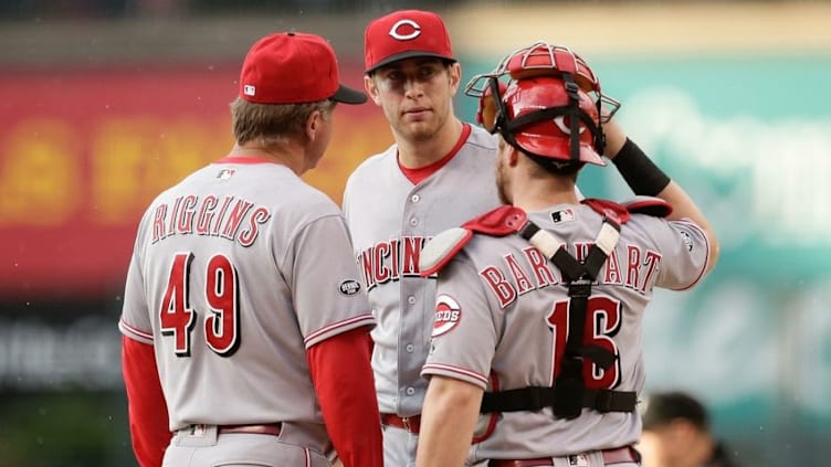 May 31, 2016; Denver, CO, USA; Cincinnati Reds pitching coach Mark Riggins (49) and catcher Tucker Barnhart (16) talk with starting pitcher Jon Moscot (46) in the first inning against the Colorado Rockies at Coors Field. Mandatory Credit: Isaiah J. Downing-USA TODAY Sports